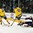 GRAND FORKS, NORTH DAKOTA - APRIL 16: Sweden's Isac Lundestrom #17 and Rickard Hugg #15 both attempt to play the puck while USA's Ryan Lindgren #18 looks on during preliminary round action at the 2016 IIHF Ice Hockey U18 World Championship. (Photo by Minas Panagiotakis/HHOF-IIHF Images)

